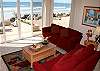 Living room with windows opening up to