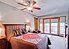 The second bedroom offers a queen bed, full bath and private balcony