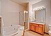 Enjoy the spacious master bath with a two-person, jetted tub.