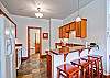 F04 has a full kitchen.  The door to the back is a second entrance to the master bathroom.