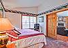 The master bedroom has a king-sized bed.