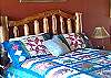 Handcrafted Aspen bed is queen sized with a new mattress.
