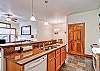 This handicap accessible condo has extra room in the kitchen and lower counters.