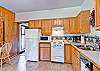 The full kitchen is well stocked for your cooking needs.