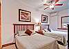 The third bedroom offers additional sleeping room with two queen-sized beds.