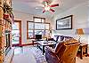 The living area and entry for F02.  Enjoy the gas fireplace and views out your front window.