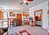 F04's living and dining areas. The master bedroom is to the right.  The staircase to the additional two bedrooms is on the left.