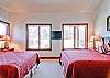 The second bedroom offers two queen sized beds and amazing views of the Lumpy Ridge and MacGregor Ranch.