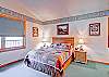 The master bedroom has a queen-sized bed.