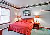 The master bedroom has a king-sized bed.