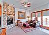F04 - The main living area and entry.  The gas fireplace is convenient and there is a sleeper sofa for extra occupancy.