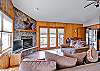 looking from the entry of this well appointed condo to the living area, dining and kitchen. Complete with private balcony and gas fireplace.