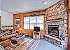 Enjoy the gas fireplace and views out the entry way.