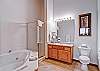 The bath has a two-person jetted tub and separate shower.
