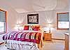 The master bedroom offers a king sized bed.