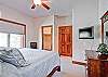 Master bedroom with walk-in closet and private bath entry.
