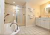 An elongated single vanity can be found in the guest bath, accessible only from the guest bedroom.
