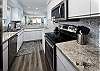 Features stainless steel appliances with lots of cabinet & counter space