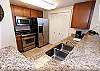 This kitchen includes all stainless steel appliances.