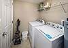Spacious laundry room with a full size washer and dryer for all your laundry needs. 
