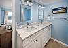 Features a double vanity and plenty of space for storage.