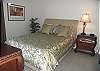 A queen sized bed and incredible views grace the guest bedroom.