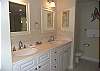 There is plenty of space to get ready with this double sink vanity in the master bathroom.