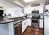 Granite and stainless kitchen featuring filtered water and ice, flat range stove and fresh cabinetry for the true updated kitchen!!