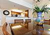 The dining room table has a polished finish with ample space to dine on.