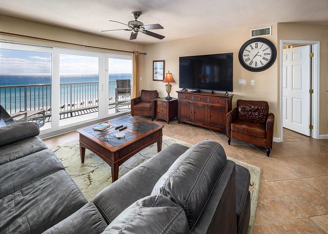 Spacious beach front living room with balcony access and awesome views!