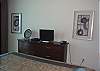 Another flat screen TV and DVD player are located in the master bedroom.