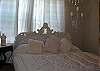 More antiques and chandelars in the second bedroom upstairs.