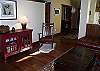 Living room with hardwood floors, original art and thoughtful comfort.