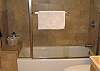 Travertin tile bathroom.