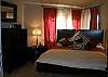 The large master suite with a reading couch.