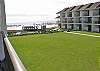 Relaxing townhome with sideview of the beach! Pool, 3 TVs,  parking