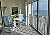 Glass enclosed balcony - can open or close sliding glass doors on rail.