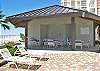 Outdoor pool house with covered area and restrooms.