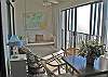 Glass enclosed balcony.  Can open or close sliding glass doors on rail.