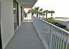 Wrap-around balcony on west side.