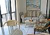 Glass enclosed balcony. Can open or close sliding glass doors on rail.