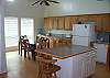 Partial view of kitchen into the dining area.