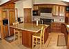 The gourmet kitchen has granite counter tops, an awesome Dacor stove and a built-in fridge.  There is an excellent view of the ocean from the window above the sink.