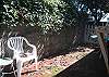 Another backyard shot. Maybe 10-12 ft. wide in the rear but both front and side doors open on to this space and it is secure.