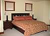 There is a king-size bed in the master bedroom.  There is a huge master bathroom with a jacuzzi tub and separate shower. This room also has a lovely gas fireplace.