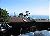 This ocean view photo does not do justice to the actual ocean view.  From many rooms in the house, you'll be able to see the ball of the sun dip into the Pacific Ocean, throughout the entire year.  If you send me an email (bob@breenrealty.com), I can send you a photo of the panoramic ocean view.