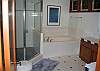 There is a separate jacuzzi tub next to the shower.