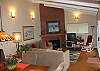 The great room and adjoining updated kitchen have huge window views overlooking the ocean.  Relax in the rocker by the fireplace and read a book.  Or watch cable TV or a selection of DVD/VHS movies.   Also use your laptop for wireless internet access.