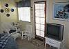 This sunny room also has access to the patio.