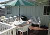 The back patio has shaded seating for six people, and there is a charcoal barbecue (if preferred over the gas BBQ).